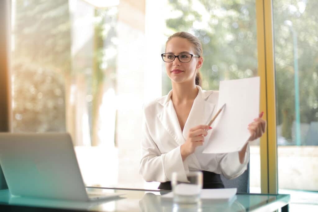 intelligent businesswoman explaining documents in office stockpack pexels scaled