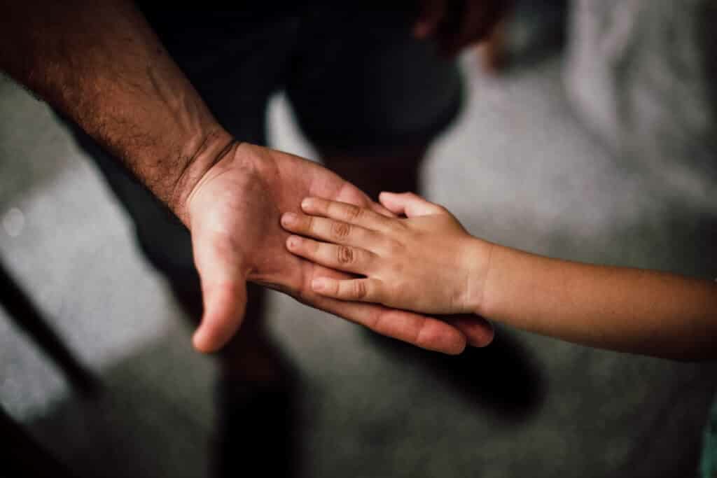 selective focus photography of child s hand stockpack pexels scaled