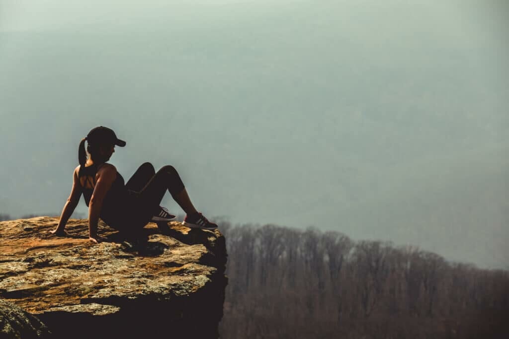 shallow focus photography of woman on rock formation stockpack pexels scaled