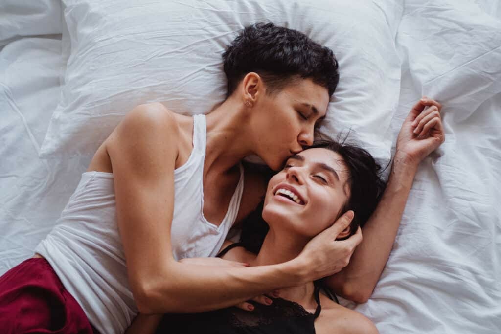 woman kissing another woman on the forehead stockpack pexels scaled