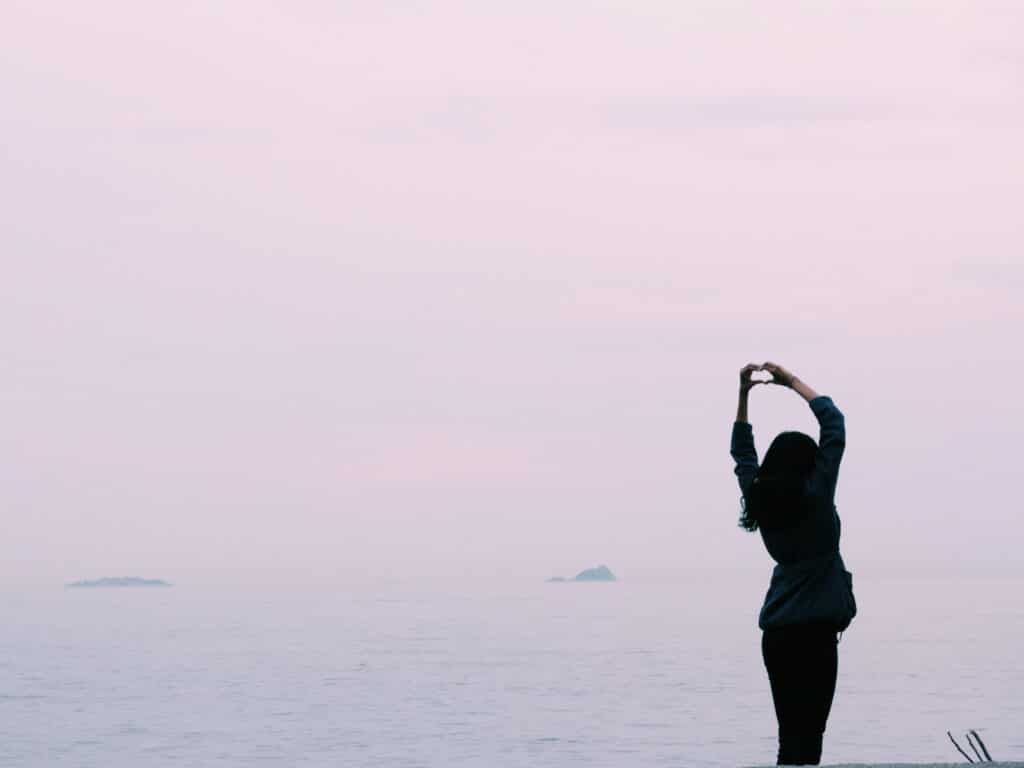 woman standing near body of water stockpack pexels scaled